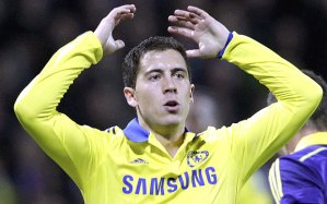 Eden Hazard raises his hands in frustration after missing a crucial penalty.